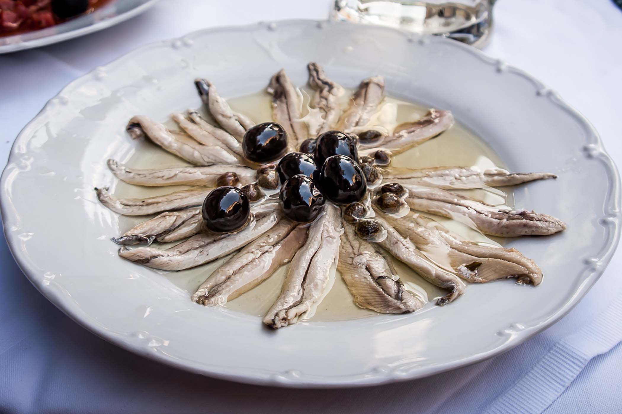 Combinazioni doc, la ricetta delle alici alla cacciatora
